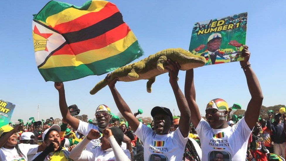 Supporters of Zimbabwe's President Emmerson Mnangagwa cheer at a rally ahead of elections at Robert Gabriel Mugabe Square in Harare, Zimbabwe - 9 August 2023