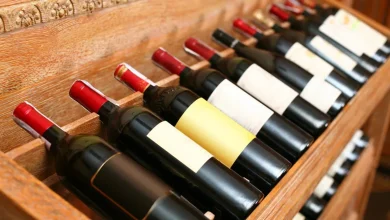 Bottles of U.S. wine sit on empty shelves in a Canadian liquor store as local alternatives take their place following sharp drops in American imports.