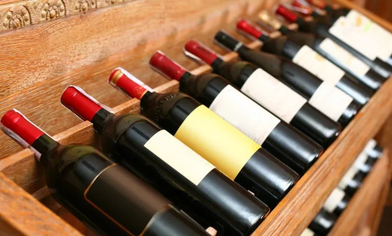 Bottles of U.S. wine sit on empty shelves in a Canadian liquor store as local alternatives take their place following sharp drops in American imports.