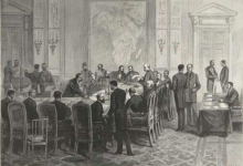 European leaders at a lavish 19th-century conference table dividing a map of Africa with rulers and ink pens.
