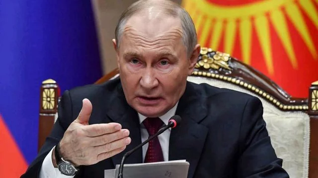 Russian President speaking during a government meeting as geopolitical tensions rise over the Middle East conflict.