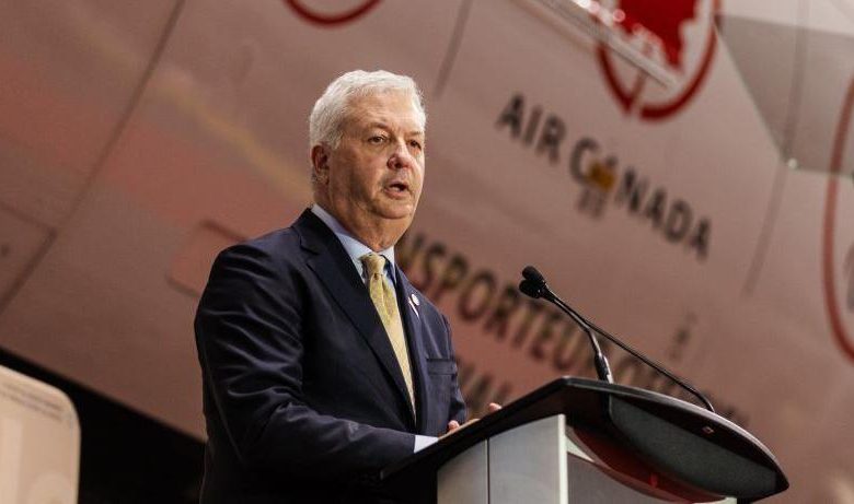 Air Canada CEO Michael Rousseau speaks at a corporate event, as the airline announces his planned retirement following recent controversy.