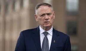 Canadian Defence Minister addressing journalists during a national security briefing.